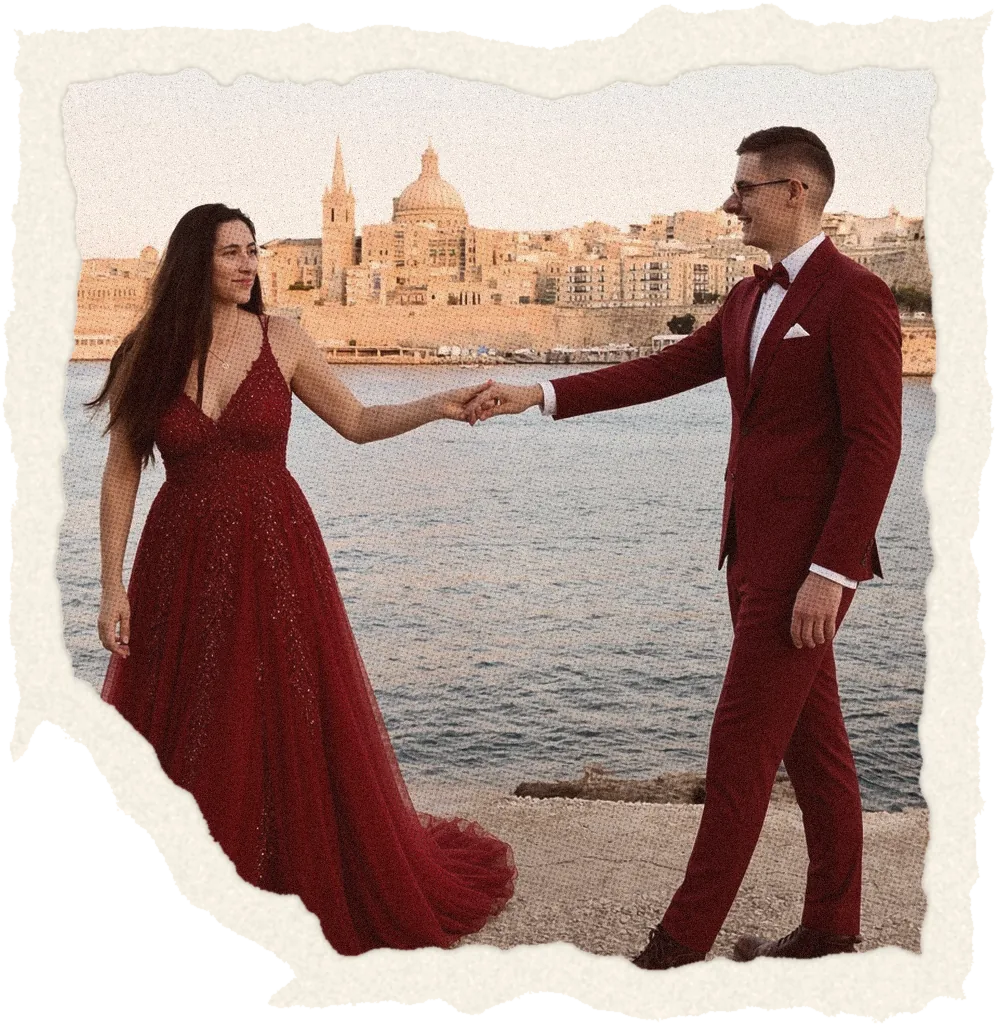 Jen and Axel holding hands by the sea